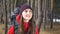 Cheerful hiker woman portrait. Beautiful smiling female wearing backpack.