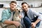 cheerful homosexual men smiling with dog