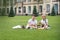 Cheerful interracial classmates holding sandwiches near