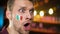 Cheerful italian fan with flag painted on cheek shouting, team scoring goal