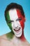 Cheerful italian supporter for FIFA 2014 looking