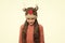 Cheerful kid. Playful cutie. Adorable baby wear cute winter knitted deer hat. Cute reindeer with red nose. Cute