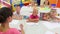 cheerful kids sitting at school class