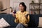 Cheerful Korean Lady Holding Credit Card And Cellphone Shopping Indoor