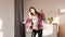 Cheerful Korean Millennial Lady Dancing Wearing Headphones Listening Music Indoor