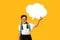 Cheerful Korean Schoolgirl Holding Blank Thought Bubble, Yellow Background, Mockup