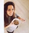 Cheerful Lady Starts the Morning Right by Eating Breakfast