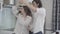 Cheerful laughing millennial couple dancing in kitchen at home. Dance of joyful young Caucasian boyfriend and girlfriend