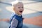 Cheerful little boy running around on the playground