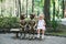 Cheerful little girl playing with park statues