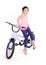 Cheerful little girl on a sports bike on a white background