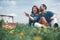 Cheerful loving couple having romantic picnic in the nature