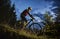 Cheerful male cyclist riding bicycle at night.