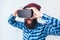 Cheerful man adjusting VR goggles