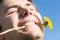 Cheerful man with dandelion portrait