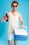 Cheerful man giving you cooling bag and bottle of soda