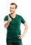 Cheerful man in green casual clothing, showing to you with index finger, isolated