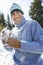 Cheerful Man Holding Snowball