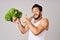 Cheerful man lettuce leaves healthy food posing