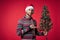 Cheerful man in a santa hat Christmas decorations holiday New Year studio posing