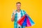 cheerful man shopaholic buy many gift packs in mall and show ok gesture, perfection