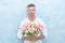 cheerful man with valentines tulips. man with valentines tulips in studio.