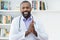 Cheerful mature adult african american doctor with beard and stethoscope