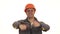 Cheerful mature constructionist in hardhat showing thumbs up
