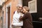 Cheerful Mature European Tourists Couple Embracing Standing Outdoors