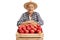 Cheerful mature farmer behind a crate filled with apples