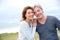 Cheerful middle-aged couple by the seaside