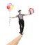 Cheerful mime walking on a wooden beam and carrying balloons and a gift box