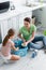 Cheerful mother and daughter sorting cans