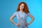 Cheerful motivated accomplished attractive redhead curly-haired ginger girl hold hands waist confident pose assertive