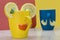 Cheerful mugs with slices of lemons,