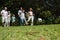 Cheerful multi generation family playing football