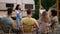 Cheerful Multicultural Friends Playing Charades Game On Outdoor Party At Camping