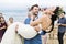 Cheerful newlyweds at beach wedding ceremony