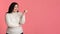 Cheerful Obese Girl Showing Aside With Finger Over Pink Background