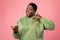 Cheerful Oversized African Lady Gesturing Call Me Over Pink Background