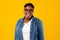 Cheerful Oversized Black Lady Wearing Eyeglasses Posing On Yellow Background