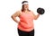 Cheerful overweight woman with a dumbbell