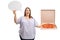 Cheerful overweight woman holding a speech bubble and a pizza