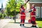 Cheerful paramedical staff shaking hands on the street