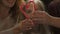 Cheerful parents forming heart from candy cane, sparkling Christmas decorations