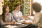 Cheerful partners handshaking in cafe, having agreement