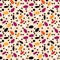 A cheerful pattern of sesame seeds on a peach background.