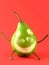 Cheerful pear on red