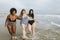 Cheerful plus size women enjoying the beach