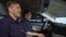 Cheerful police mates laughing in patrol car during daily duty, friendship